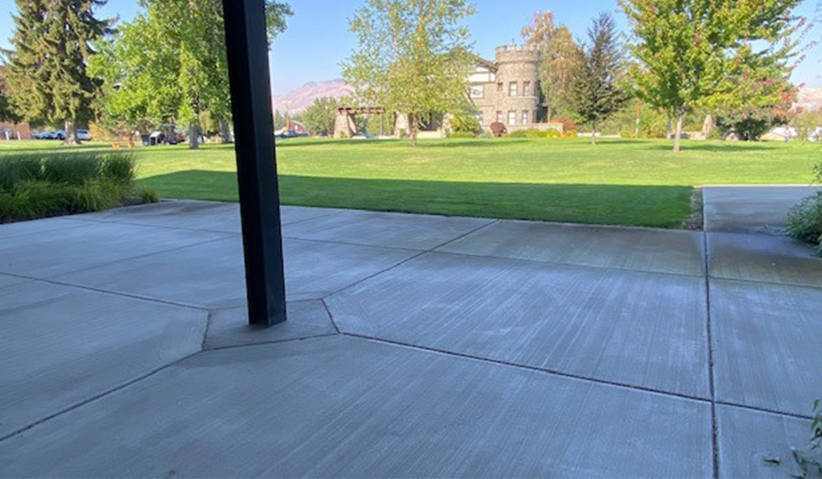 The patio at the Music and Art Center, facing a broad lawn and Wells House.