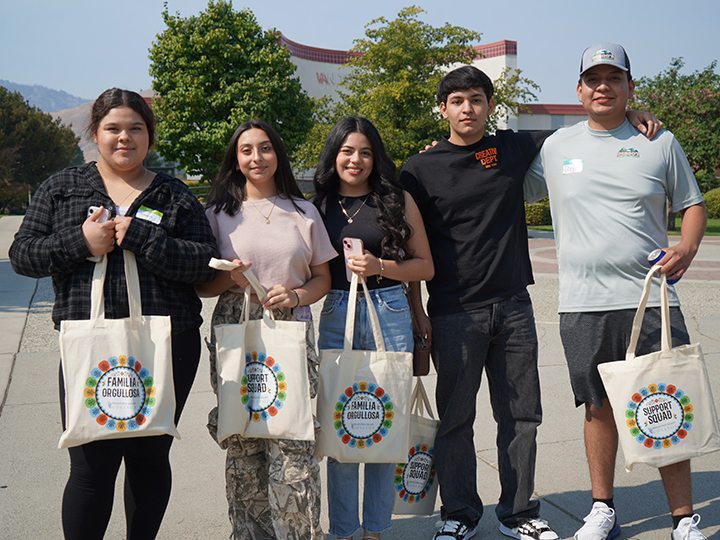 Five new students standing out of Van Tassell Center.