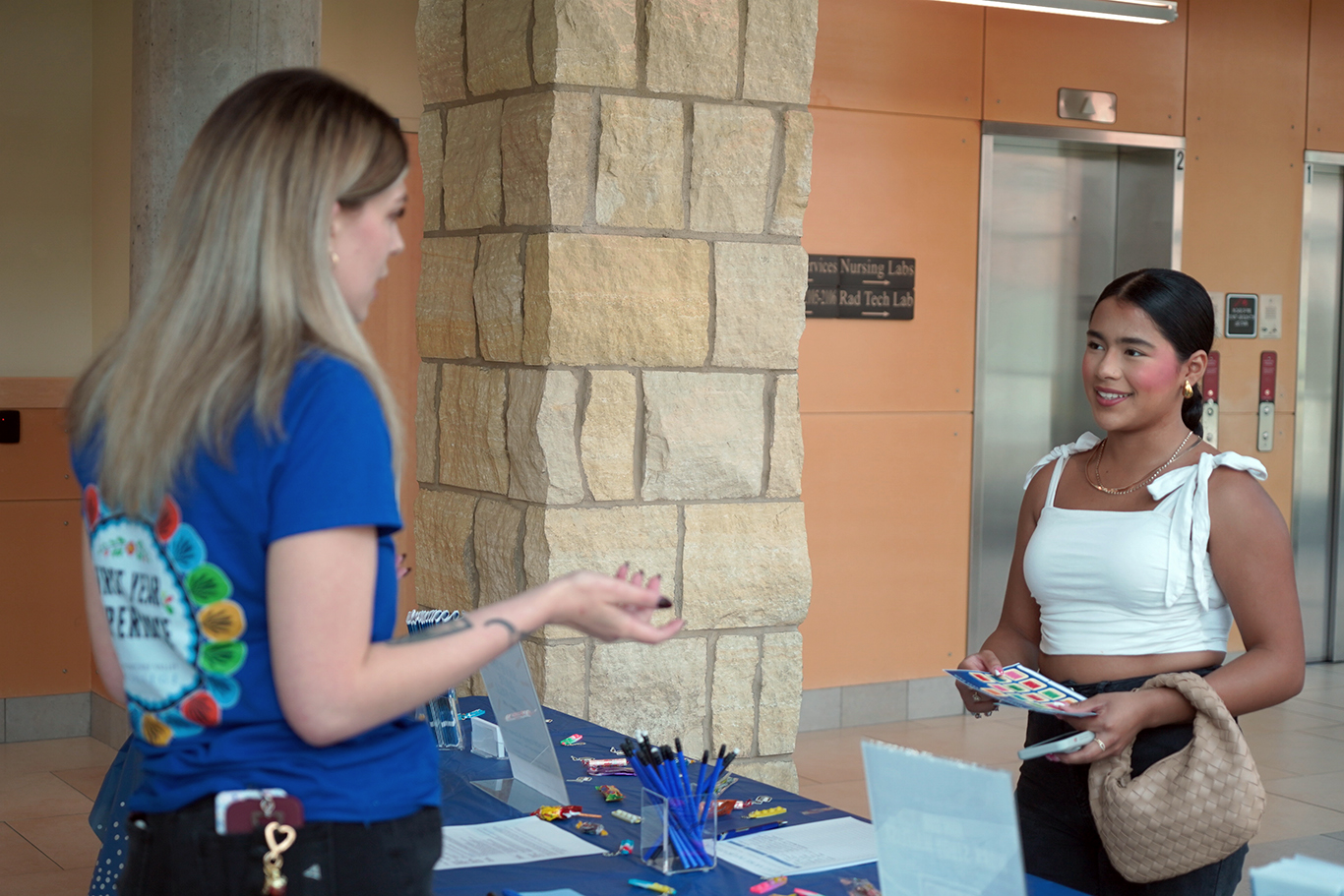 Staff member helping new student