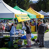 Community members explore booths at the 2025 Sustainable NCW Earth Day Fair on the Wenatchee campus.