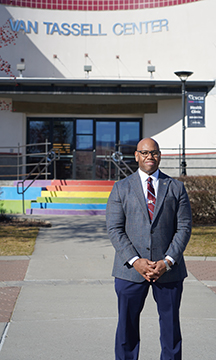Portrait of WVC President Faimous Harrison standing in front of Van Tassell Center on the Wenatchee campus.