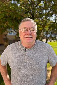 Portrait of Jeff Dykes standing outside