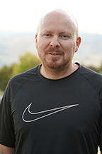 Portrait of Luis Mendoza standing outside.