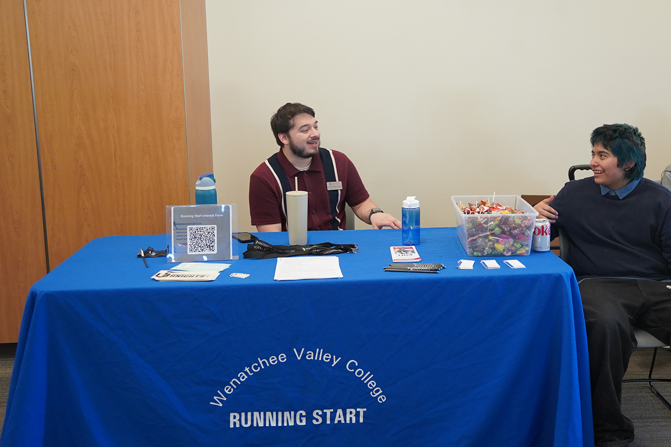 Staff member talking to student