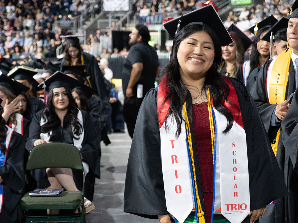 TRIO student graduating